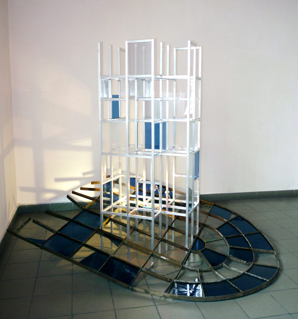 Large-scale sculptural installation and art object titled Metamorphosis from 2012, made of steel, aluminum, glass, and plexiglass with an integrated LED lighting system, by Danuta Krajewska-Pietrasik.