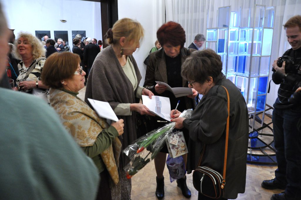 Photograph documenting the opening of Danuta Krajewska-Pietrasik's solo exhibition titled Łódź-Past Imperfect Time, organized in 2014 at POS Łódź.
